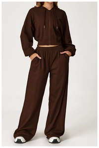 Detailed texture of dark coffee loose high waist sports pants and cropped zip hoodie