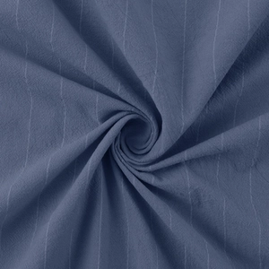 Close-up showing the high-quality vertical stripes and texture of the blue linen shirt fabric