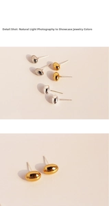 Detailed view of polished oval stud earrings in gold, silver, and gunmetal finishes