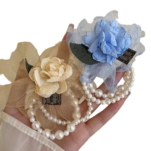 Elegant lace rose hair claw with pearl chains in blue and champagne colors