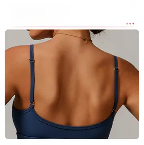 Detail of navy yoga bra featuring an open square back and adjustable thin straps