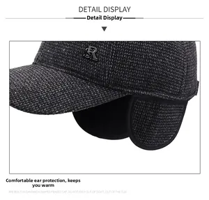 Detail view of winter baseball cap with foldable ear flaps and metallic SR logo