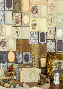 Close-up of vintage scrapbook paper set with retro lace patterns and artistic textures