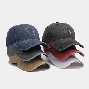 Detailed view of six vintage washed cotton baseball caps with funny cat embroidery
