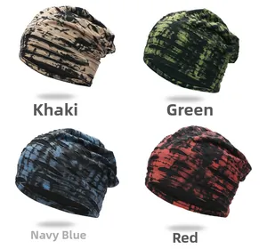 Detail shot of distressed tie-dye slouchy beanies in khaki, green, navy, and red colors