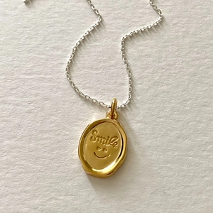 Minimalist 925 sterling silver smile necklace with oval gold pendant and silver chain