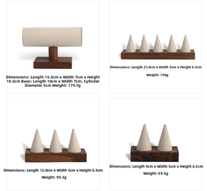 Detail view of walnut wood jewelry stands with beige velvet ring cones and T-bar display