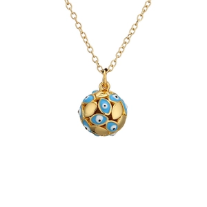 Macro shot of gold spherical pendant necklace featuring blue evil eye enamel and filigree