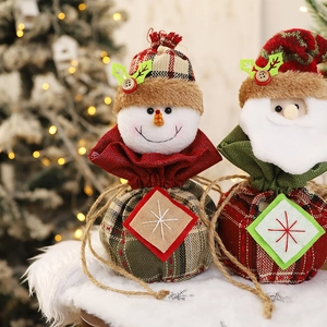 Plaid Christmas gift bags with Santa and Snowman designs featuring drawstring closure