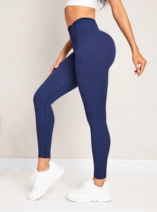 Detailed back view of high-waisted seamless navy blue yoga leggings with ruched butt lift