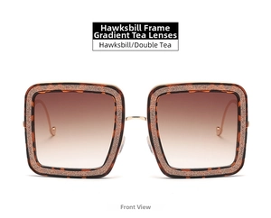 Front view of square tortoiseshell sunglasses with brown gradient lenses and gold glitter