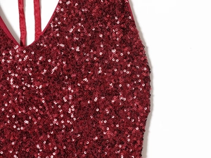 Macro detail of wine red sequins and delicate stitching on the V-neck party dress