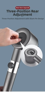 Detail view of dark grey pressurized shower head with three-speed adjustable switch and massage fins