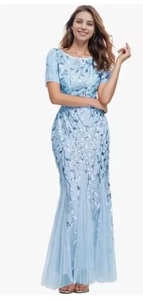 Detail of light blue mesh evening gown with silver sequin leaf embroidery and fishtail hem