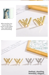 Detail of W-shaped earrings with micro-pave crystals in gold and silver finish
