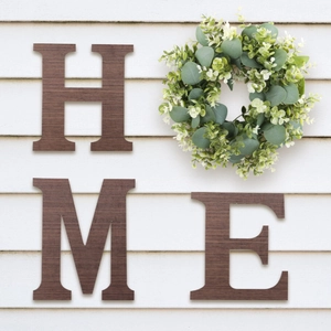 Creative walnut wood HOME wall decor with artificial eucalyptus wreath on white background