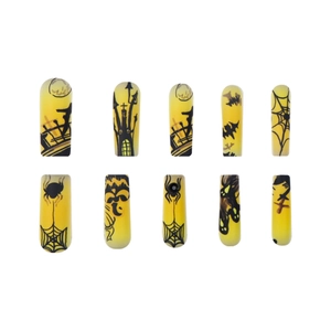 Halloween press-on nails with pumpkin, ghost, and castle patterns on yellow long coffin tips