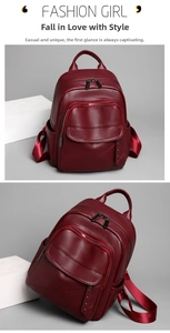 Detail view of wine red PU leather backpack showing texture and multi-zipper pockets
