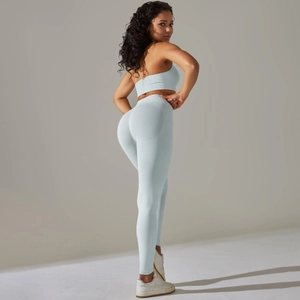 Detail of ribbed texture on ice blue seamless yoga leggings and sports bra set