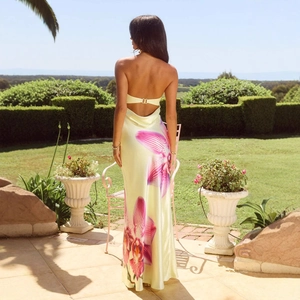 Elegant backless floral maxi dress in yellow silk satin for a luxury vacation look