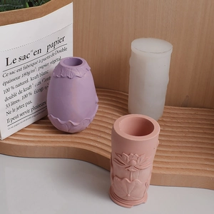 Detailed relief lotus leaf patterns on a silicone mold and finished plaster candle holders