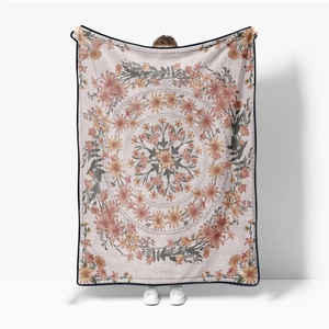 Detailed view of soft flannel blanket featuring an intricate floral mandala art pattern
