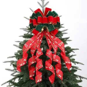 Large Christmas tree topper bow with red and green velvet and festive printed ribbons