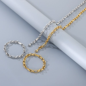 Detail of hip hop stainless steel chain necklace and bracelet set in gold and silver
