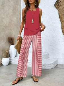 Detail of red sleeveless top and high waist red-white striped wide leg pants set