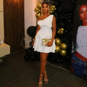 Elegant white one-shoulder mini dress with waist rosette and A-line silhouette