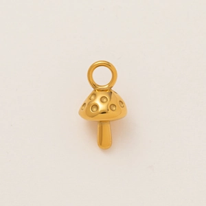 Macro shot of 18K gold plated stainless steel mushroom pendant with textured dotted cap