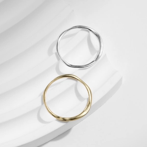 Minimalist S925 sterling silver Mobius rings in gold and silver finish on display
