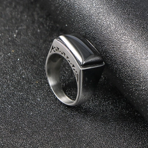 Men's stainless steel signet ring featuring black zircon stone and filigree side patterns