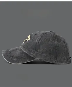 Close-up of golden New York embroidery on washed cotton baseball cap with vintage texture