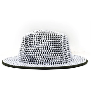 Detailed close-up of a silver fedora hat fully embellished with lustrous pearls and black trim
