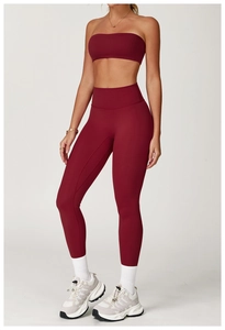 Detail view of burgundy yoga set featuring strapless sports bra and high-waist leggings