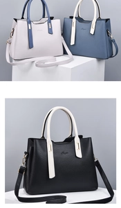 Close-up of textured PU leather tote bags in white and blue with metal hardware