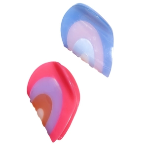 Set of two French heart hair claws in pastel gradient colors on a white background