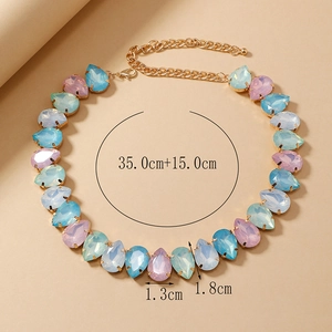 Detail of gold necklace with pear-shaped blue and pink stones, length 35cm plus 15cm