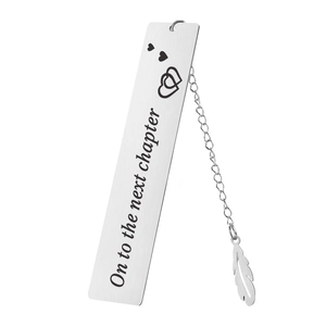 Detail of stainless steel bookmark with chain, feather pendant and heart engraving