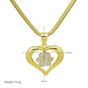 Detail shot of heart pendant with crystal paw print showing 36mm height and 30mm width