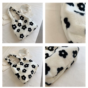 Detailed views of white plush tote bag with black floral patterns and sturdy handles