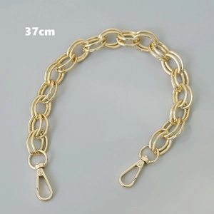 Detailed view of a 37cm chunky gold metal chain strap with lobster clasps for handbags