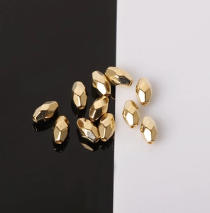 Macro shot of gold faceted CCB beads for DIY jewelry making and bracelet stringing
