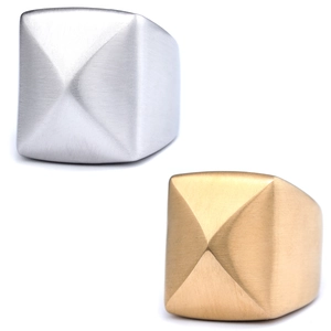 Detailed view of matte brushed stainless steel square rings in gold and silver