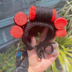 Handcrafted knitted pet wig hat with red hair rollers for funny Halloween costumes