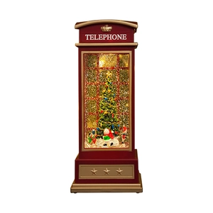 Red Christmas telephone booth music box with sparkling snow and festive tree display