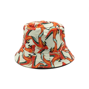 Double-sided bucket hat with vibrant red and orange abstract flame pattern on white canvas