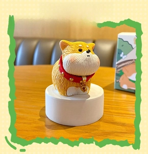 Macro detail of Shiba Inu resin figure with hair texture and a red bell collar