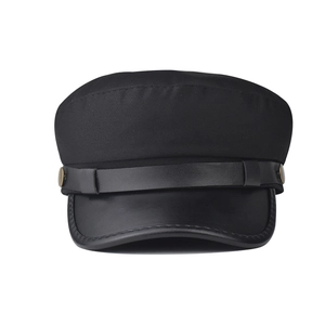Classic black baker boy cap featuring a leather brim and decorative metal buttons